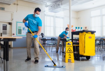 ServiceMaster clean employee cleaning tile floor