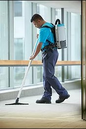 A ServiceMaster Clean team member cleaning a carpet during commercial janitorial services