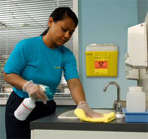 woman wiping surface in hospital