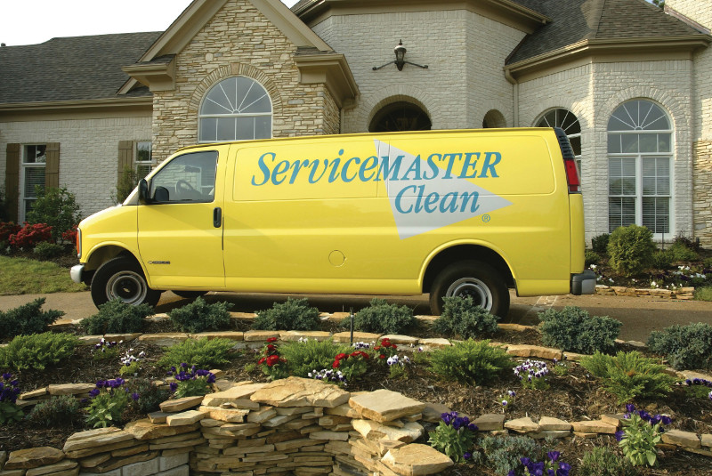 servicemaster clean van outside a home 
