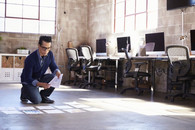 man inspecting floor