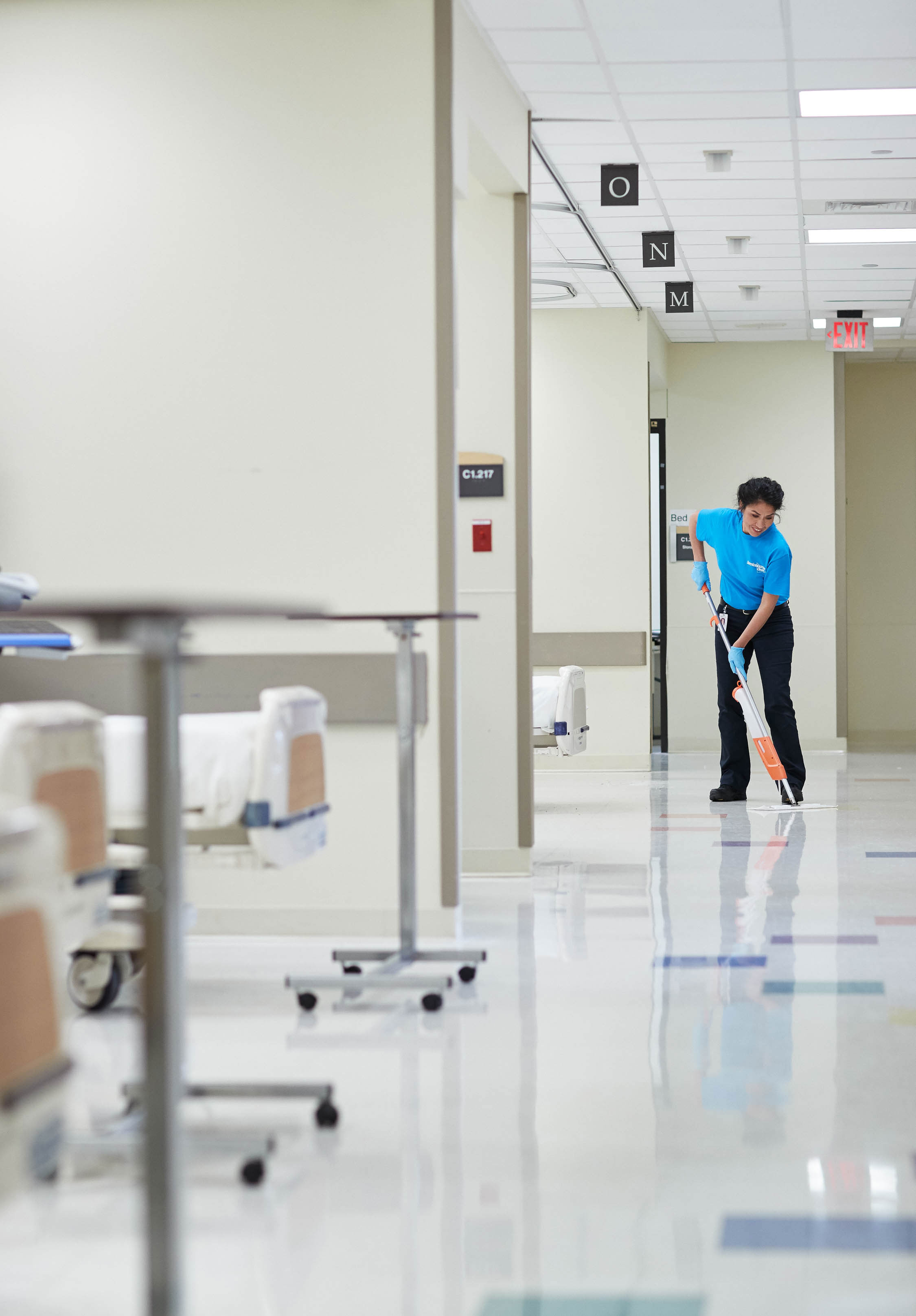 A ServiceMaster tech sanitizing a floor in an emergency room during medical cleaning services