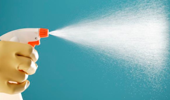 person cleaning wall at risk of cross-contamination