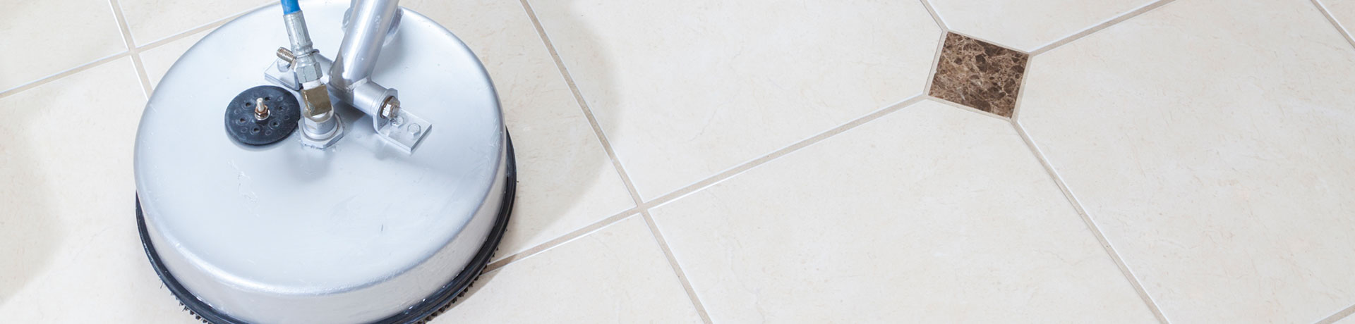 A tile and grout commercial cleaning device scrubbing floors clean