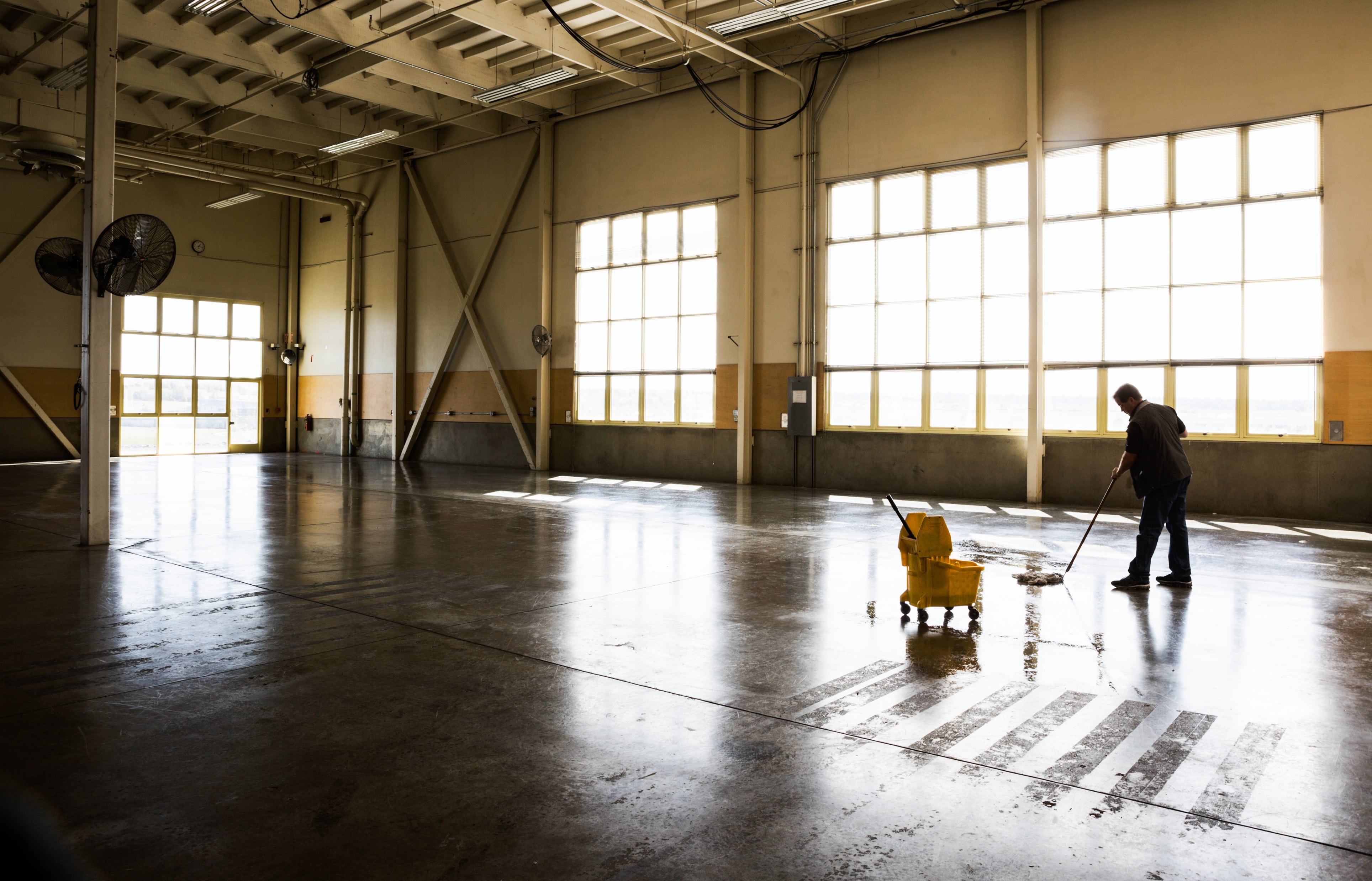warehouse cleaning services include sweeping, mopping and floor polishing for hard surface floors