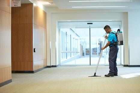 man cleaning carpet.