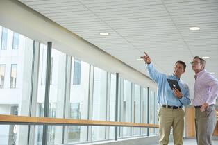 two men in an office building