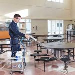 man spraying disinfectant